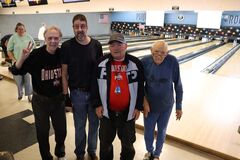 Four fellas bowling.