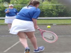 Playing tennis